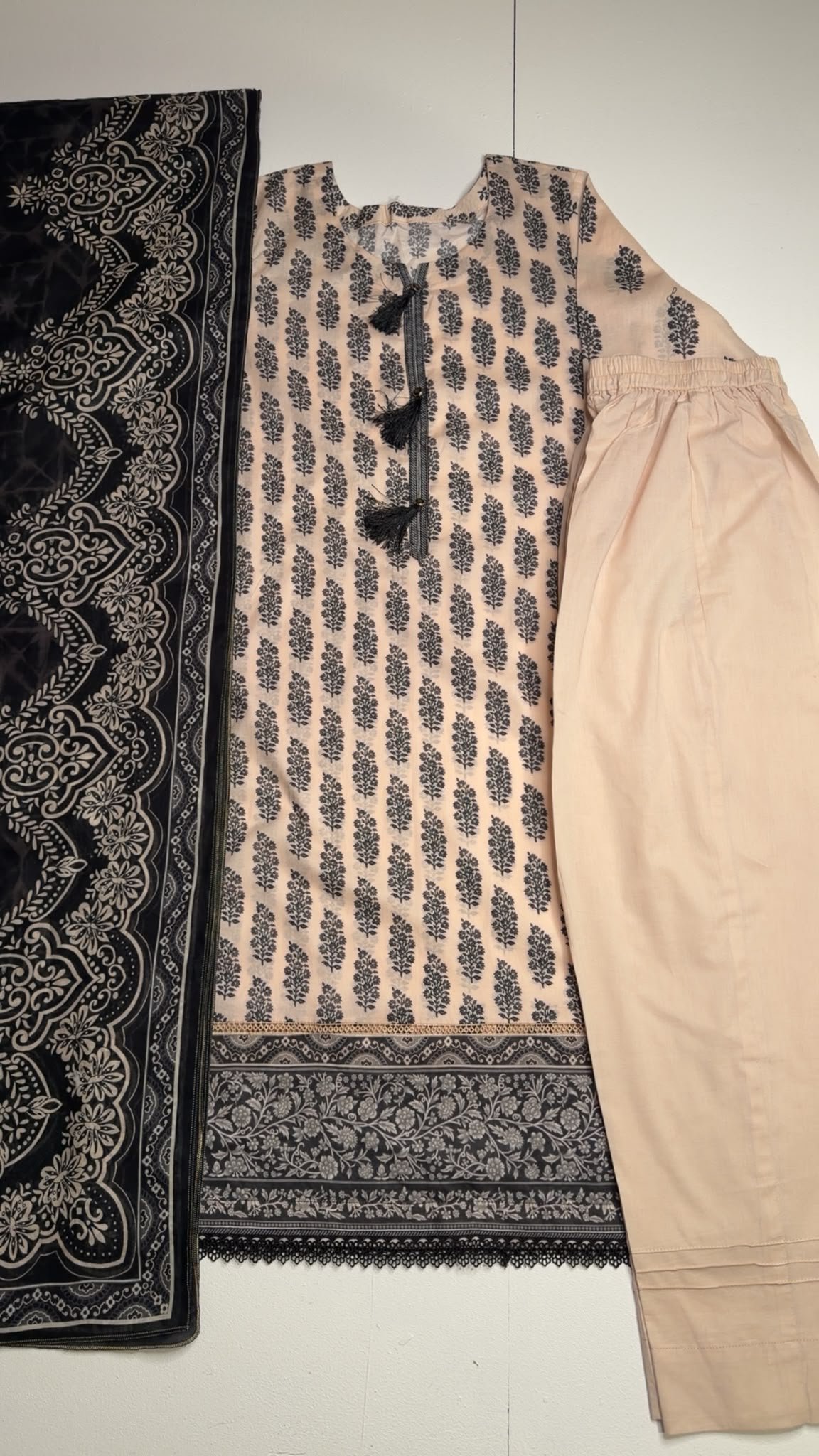 2026/07/1000340431.jpg Peach and Black Printed Lawn Suit - Image 1